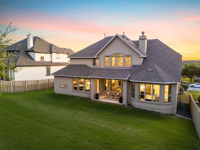 17012 Rush Pea Cir, Austin, TX 78738 - rear view of house with a chimney, a shingled roof, a patio area, and stucco siding
