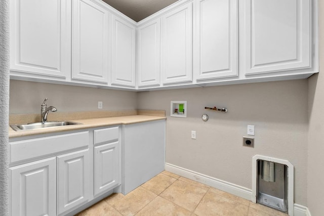 404 Oak Meadow Dr, Georgetown, TX 78628 - laundry room with cabinet space, electric dryer hookup, hookup for a gas dryer, hookup for a washing machine, and light tile patterned flooring
