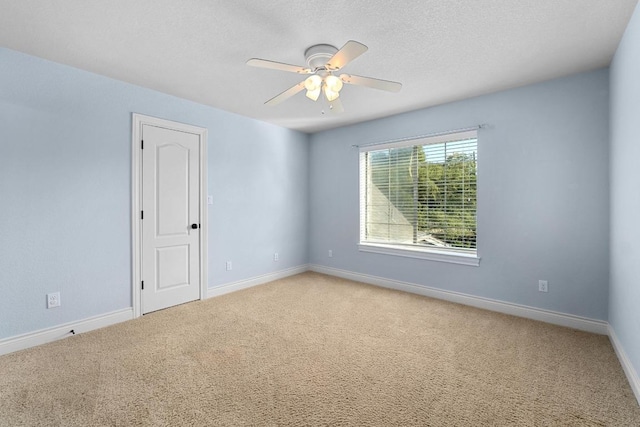 404 Oak Meadow Dr, Georgetown, TX 78628 - carpeted empty room featuring a ceiling fan and a textured ceiling