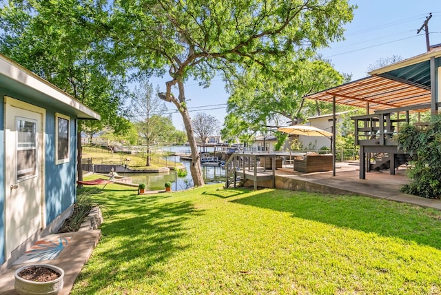 1707 Aztec Trl, Kingsland, TX 78639 - view of grassy yard with a water view and a patio