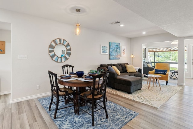 1707 Aztec Trl, Kingsland, TX 78639 - dining room featuring wood finished floors, recessed lighting, and baseboards
