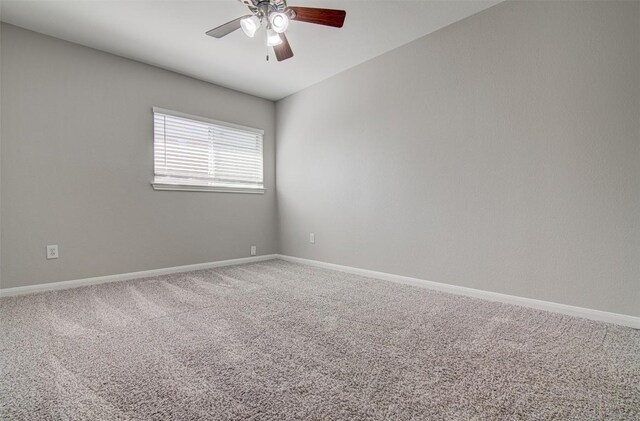 233 Devonshire Dr, Kyle, TX 78640 - carpeted empty room with a ceiling fan and baseboards