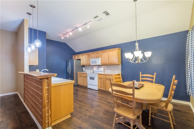 kitchen with white appliances, vaulted ceiling, dark wood-style flooring, light countertops, and light brown cabinets
