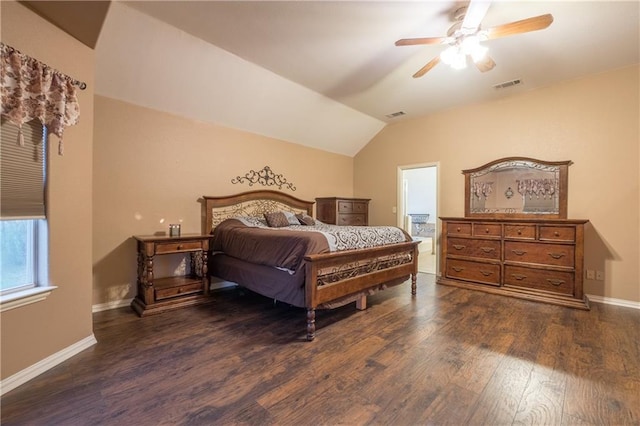 bedroom featuring visible vents, baseboards, lofted ceiling, and dark wood finished floors