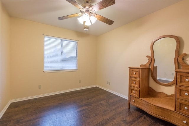bedroom with dark wood-style flooring, baseboards, and ceiling fan