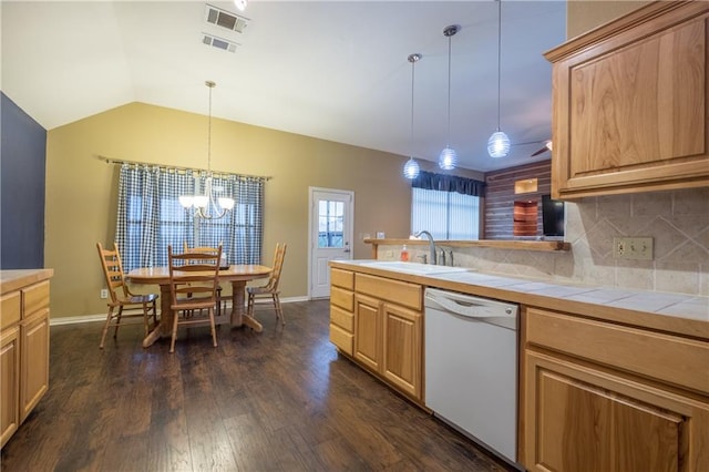 159 Klbj Rd, Smithville, TX 78957 - kitchen featuring dishwasher, tile counters, a chandelier, decorative backsplash, and dark wood-style flooring