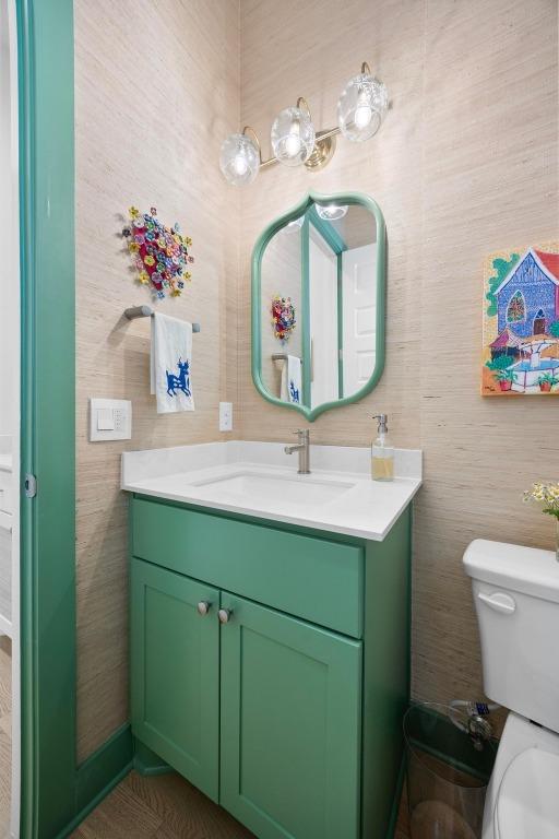 bathroom with toilet and vanity