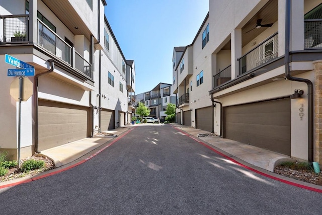 view of road featuring sidewalks, curbs, and a residential view