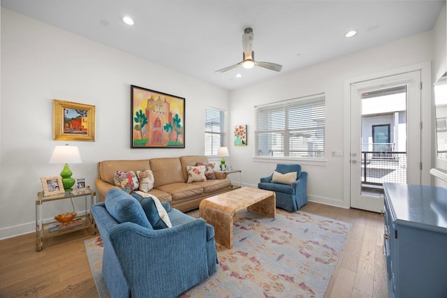living room featuring recessed lighting, light wood finished floors, and ceiling fan