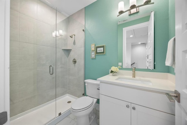 bathroom with toilet, a stall shower, vanity, and marble finish floor