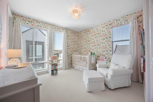 bedroom featuring wallpapered walls, multiple windows, and carpet floors
