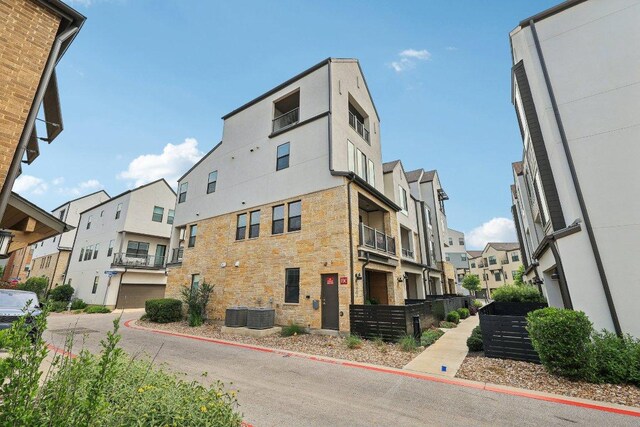 3901 Vantage Dr, Austin, TX 78731 - view of property with a residential view and central AC unit
