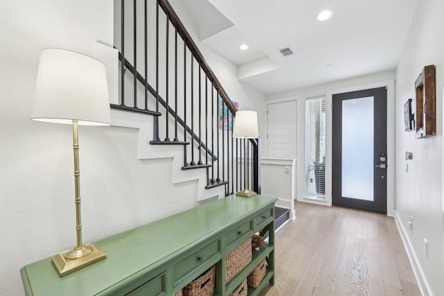 3901 Vantage Dr, Austin, TX 78731 - entryway with stairway, light wood-style floors, baseboards, and recessed lighting