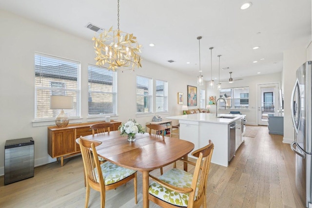 3901 Vantage Dr, Austin, TX 78731 - dining space with light wood finished floors, a chandelier, recessed lighting, and baseboards