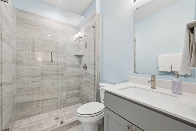 3901 Vantage Dr, Austin, TX 78731 - full bathroom featuring toilet, a shower stall, and vanity
