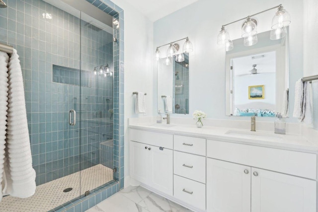3901 Vantage Dr, Austin, TX 78731 - bathroom with a shower stall, marble finish flooring, and double vanity