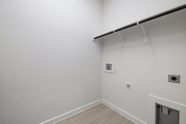 washroom featuring hookup for an electric dryer, baseboards, gas dryer hookup, laundry area, and hookup for a washing machine