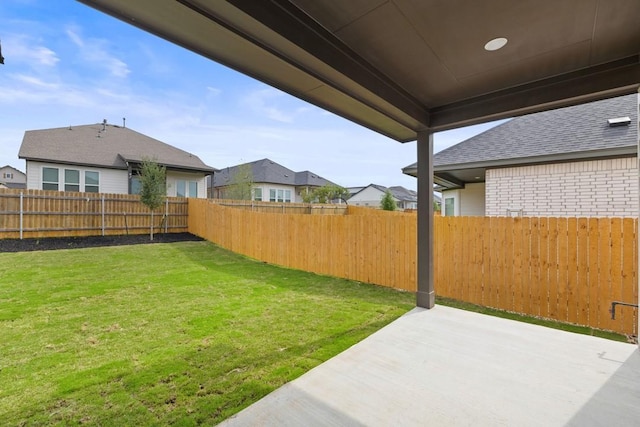 view of yard featuring a patio and a fenced backyard