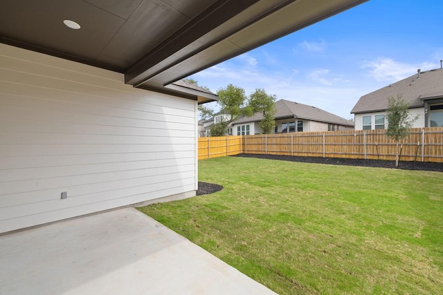 view of yard featuring a patio area and fence