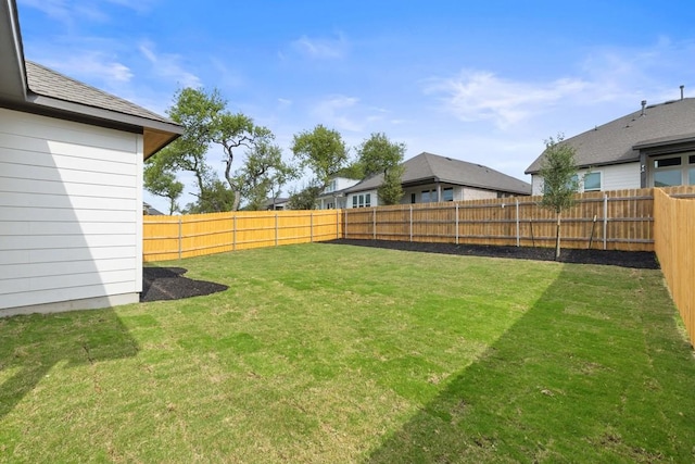 view of yard featuring a fenced backyard