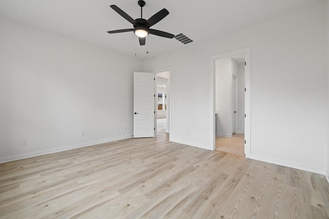 unfurnished bedroom with visible vents, baseboards, a ceiling fan, and light wood-style floors