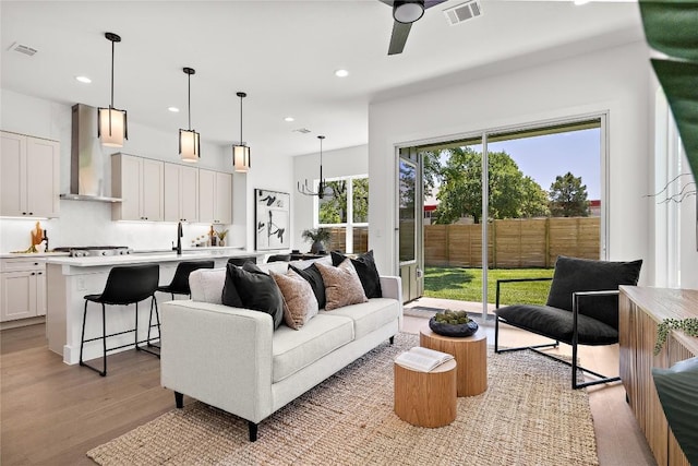1181 Leona St, Austin, TX 78702 - living area with light wood-type flooring, recessed lighting, and ceiling fan