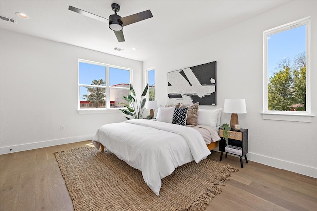 1181 Leona St, Austin, TX 78702 - bedroom featuring baseboards, light wood-type flooring, ceiling fan, and recessed lighting
