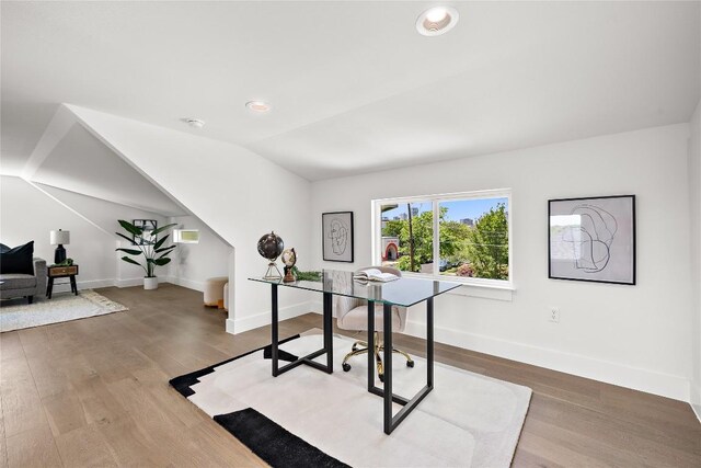 1181 Leona St, Austin, TX 78702 - office with baseboards, vaulted ceiling, wood finished floors, and recessed lighting