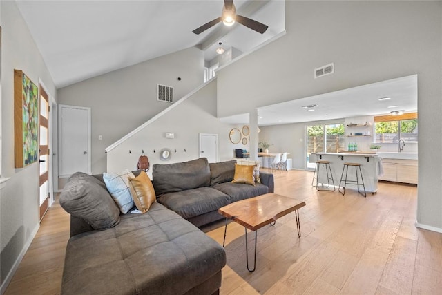 12324 Havelock Dr, Austin, TX 78759 - living room featuring light wood-style floors, a ceiling fan, and high vaulted ceiling