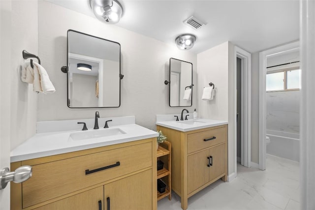12324 Havelock Dr, Austin, TX 78759 - bathroom featuring marble finish flooring and two vanities