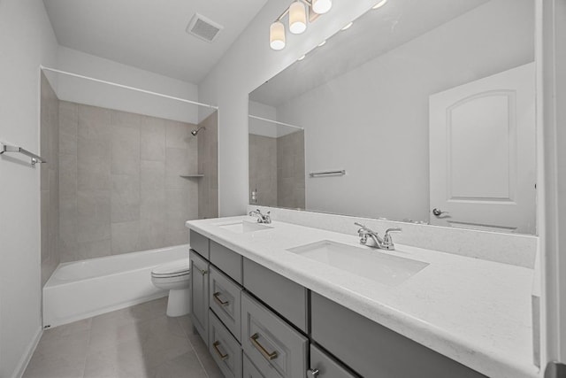 409 Dycus Bnd, Liberty Hill, TX 78642 - full bath featuring double vanity, toilet, shower / bath combination, tile patterned floors, and baseboards