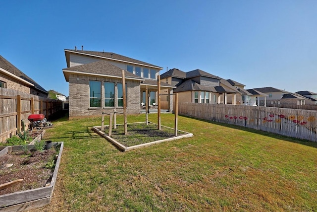 409 Dycus Bnd, Liberty Hill, TX 78642 - back of house with a garden and brick siding