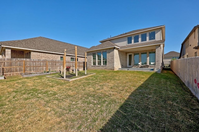 409 Dycus Bnd, Liberty Hill, TX 78642 - back of house with brick siding and a patio area