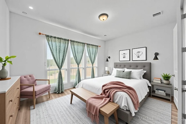 409 Dycus Bnd, Liberty Hill, TX 78642 - bedroom with light wood-style flooring