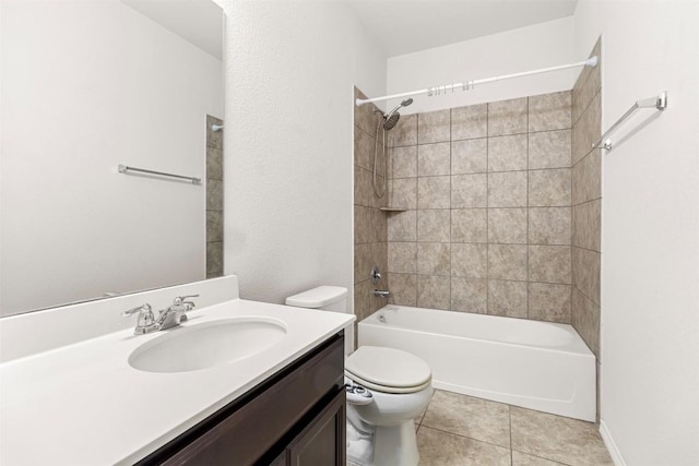 bathroom with vanity, tile patterned flooring, washtub / shower combination, and toilet
