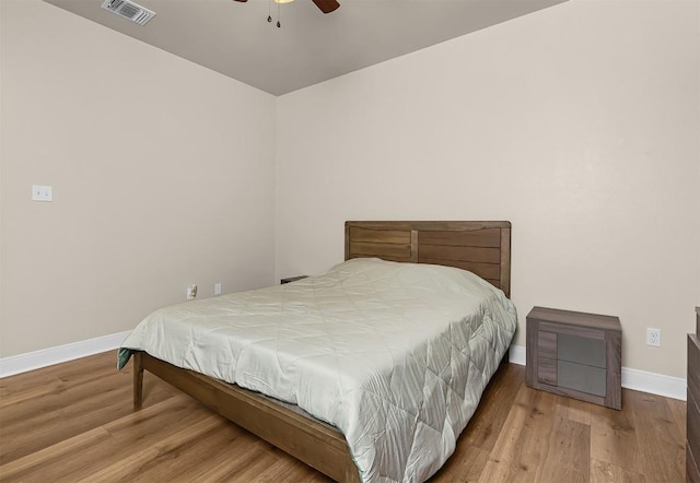 125 Brahman Ct, Bastrop, TX 78602 - bedroom with baseboards, wood finished floors, and ceiling fan