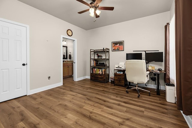 125 Brahman Ct, Bastrop, TX 78602 - home office featuring a ceiling fan, wood finished floors, and baseboards