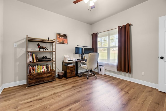 125 Brahman Ct, Bastrop, TX 78602 - office area featuring wood finished floors, a ceiling fan, and baseboards