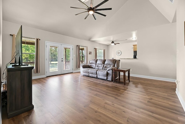 125 Brahman Ct, Bastrop, TX 78602 - living room featuring ceiling fan, wood finished floors, baseboards, french doors, and high vaulted ceiling