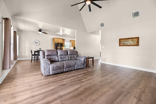 125 Brahman Ct, Bastrop, TX 78602 - living room with ceiling fan, high vaulted ceiling, light wood-style flooring, and baseboards