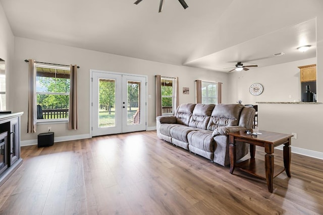 125 Brahman Ct, Bastrop, TX 78602 - living area featuring a ceiling fan, dark wood-style flooring, french doors, and baseboards