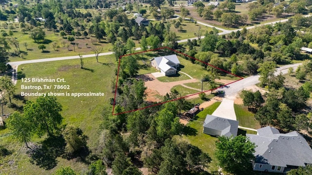 125 Brahman Ct, Bastrop, TX 78602 - aerial view of property and surrounding area with property boundaries highlighted