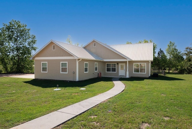 125 Brahman Ct, Bastrop, TX 78602 - view of front of property featuring a front yard and metal roof