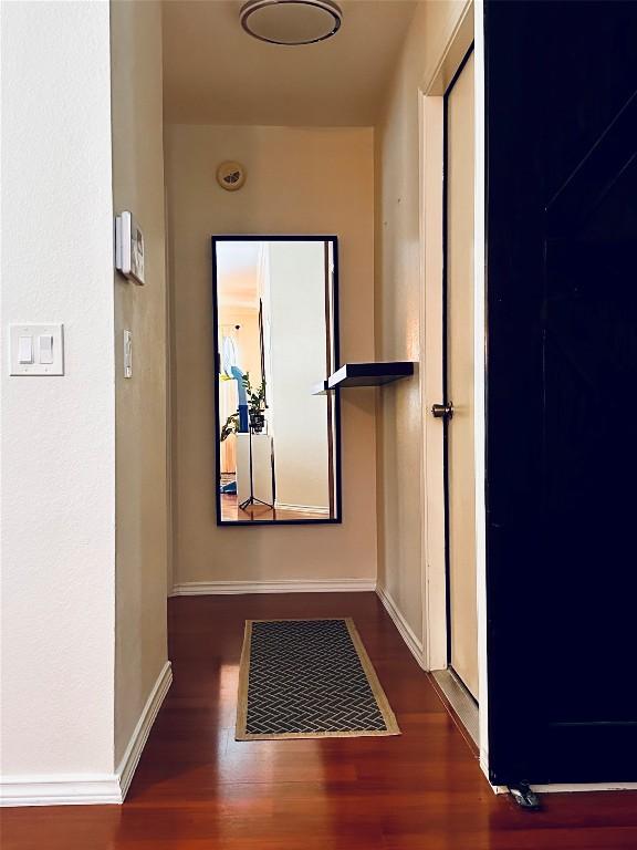 16903 Isle Of Man Rd, Pflugerville, TX 78660 - hall featuring wood finished floors and baseboards