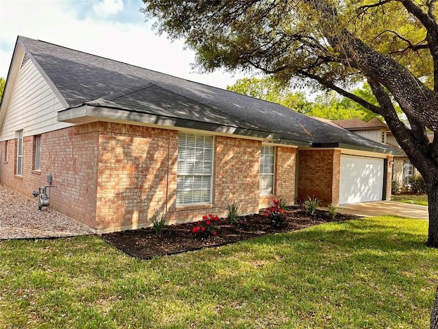 16903 Isle Of Man Rd, Pflugerville, TX 78660 - view of front facade featuring brick siding, a garage, a shingled roof, a front yard, and driveway