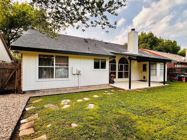16903 Isle Of Man Rd, Pflugerville, TX 78660 - back of property with a patio, a chimney, and roof with shingles