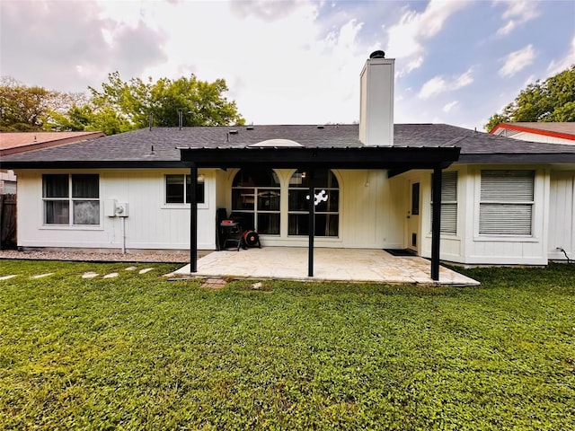16903 Isle Of Man Rd, Pflugerville, TX 78660 - rear view of house featuring a patio, roof with shingles, and a chimney