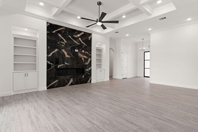 112 Vista De Luna Ln, Belton, TX 76513 - unfurnished living room with built in shelves, recessed lighting, ornamental molding, coffered ceiling, and wood finished floors