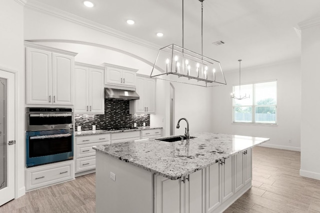 112 Vista De Luna Ln, Belton, TX 76513 - kitchen featuring a chandelier, exhaust hood, crown molding, double oven, and decorative backsplash