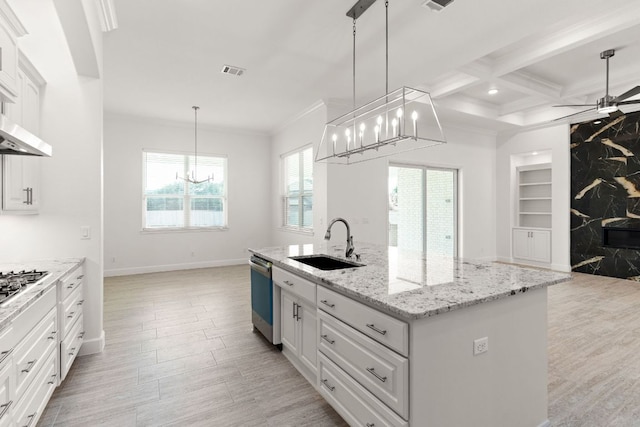 112 Vista De Luna Ln, Belton, TX 76513 - kitchen with dishwasher, a chandelier, built in features, open floor plan, and light wood-style floors